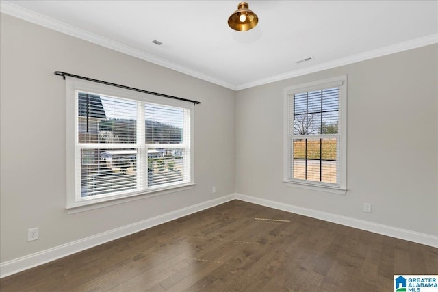 unfurnished room featuring visible vents, crown molding, baseboards, and dark wood-style flooring