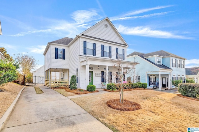 view of front of home with a porch and a gate