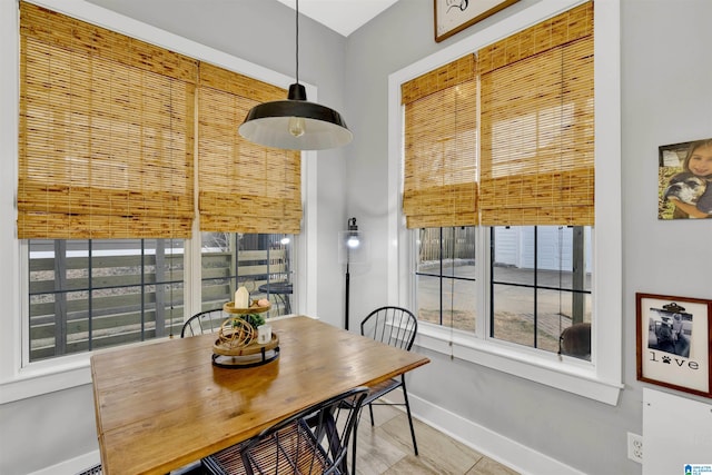 dining area featuring baseboards