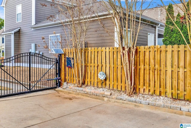 view of gate with fence