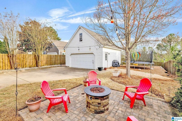 exterior space with a trampoline and fence