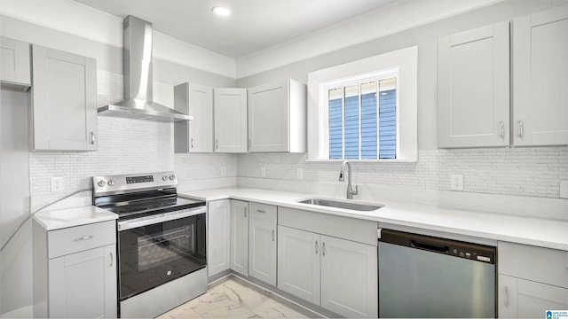 kitchen featuring marble finish floor, a sink, appliances with stainless steel finishes, wall chimney exhaust hood, and light countertops