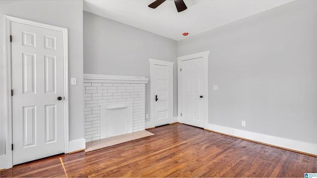 interior space featuring baseboards, wood finished floors, and ceiling fan