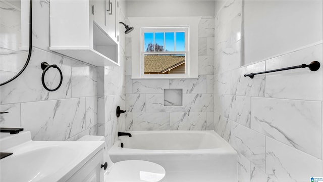 bathroom featuring vanity, tile walls, toilet, and tub / shower combination