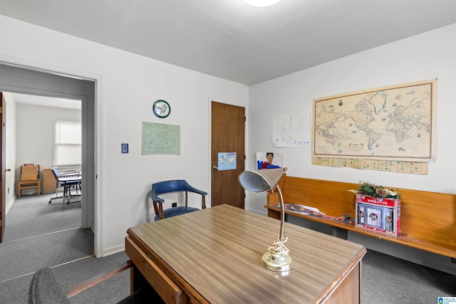 carpeted dining area with baseboards