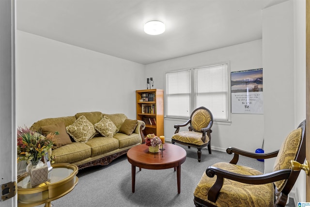 living room featuring carpet flooring and baseboards