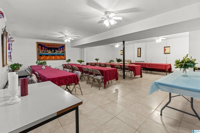 dining room with light tile patterned floors and a ceiling fan