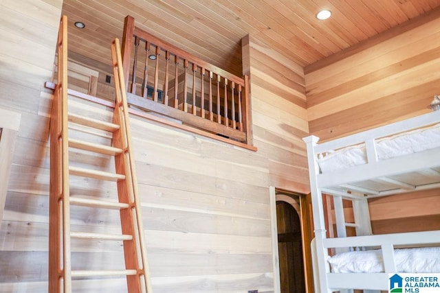 interior space featuring recessed lighting, wood walls, and wood ceiling