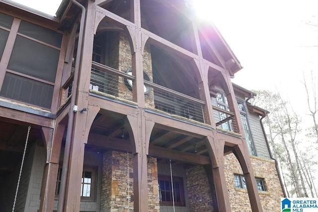 view of property exterior with stone siding