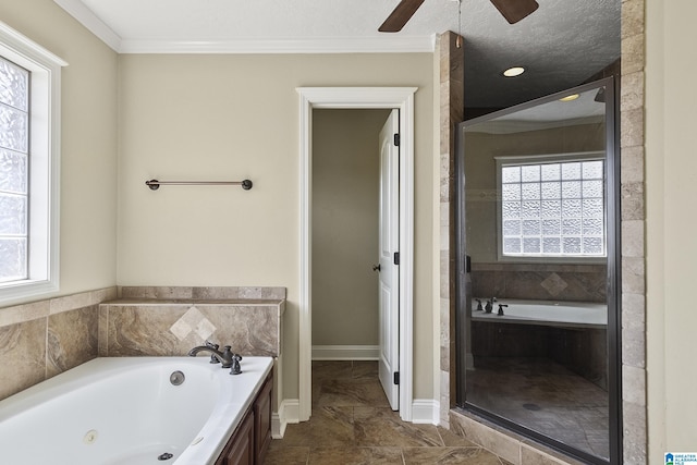 full bath featuring a stall shower, a jetted tub, ceiling fan, and ornamental molding