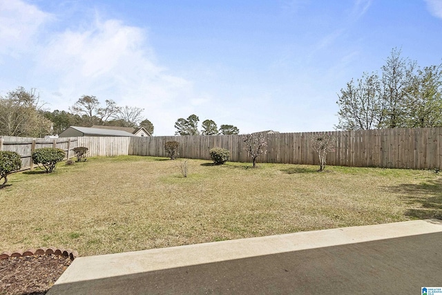 view of yard with a fenced backyard