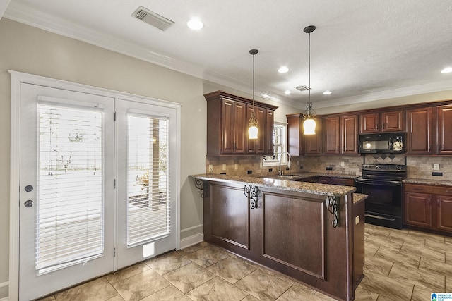 kitchen with tasteful backsplash, visible vents, a peninsula, and black appliances