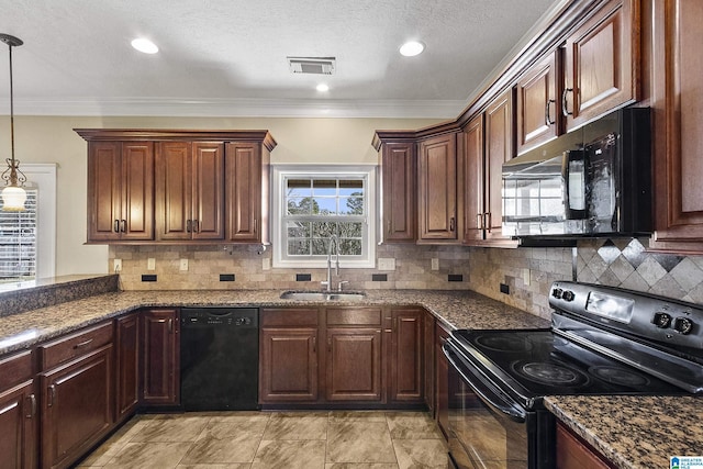 kitchen with a sink, visible vents, black appliances, and dark stone counters