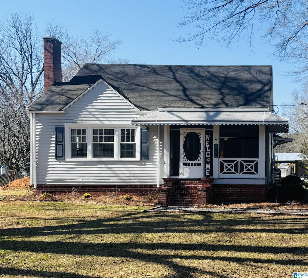 175 Forman St, Springville, AL 35146 - view of front of house with a chimney, roof with shingles, and a front yard