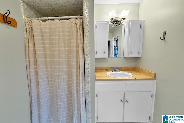 full bath with vanity and a shower with shower curtain