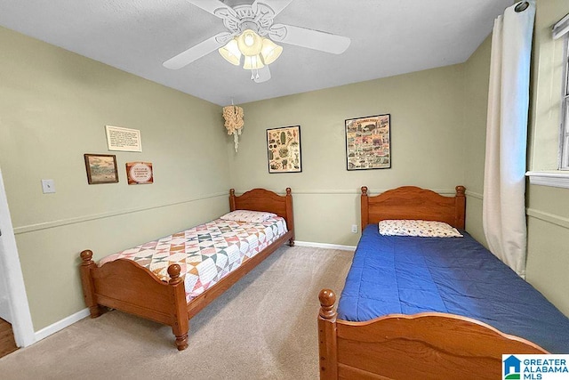 bedroom with visible vents, baseboards, a ceiling fan, and carpet flooring