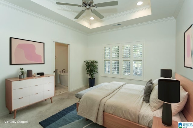 bedroom with visible vents, a tray ceiling, recessed lighting, crown molding, and light colored carpet