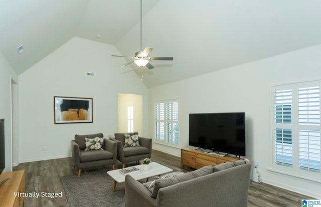 living room with wood finished floors, a wealth of natural light, and ceiling fan