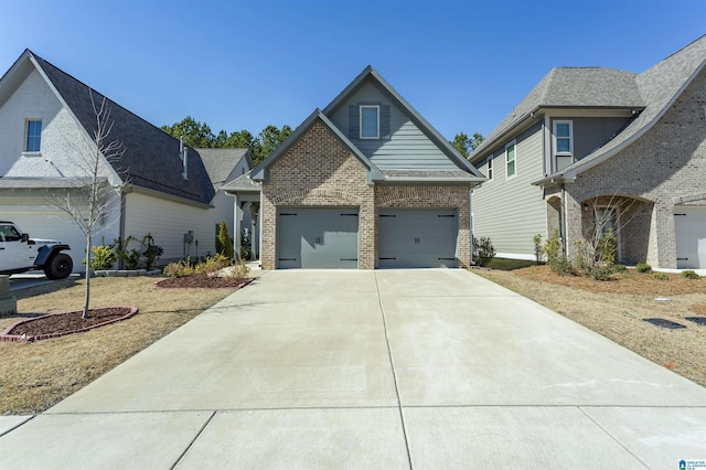 view of front of house featuring concrete driveway, a garage, and brick siding