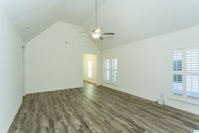 interior space with a wealth of natural light, visible vents, ceiling fan, and dark wood-style flooring