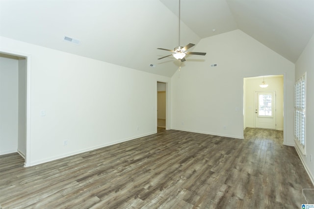 unfurnished living room with visible vents, high vaulted ceiling, a ceiling fan, wood finished floors, and baseboards