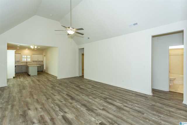 unfurnished living room with visible vents, baseboards, wood finished floors, and a ceiling fan