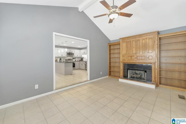 unfurnished living room with light tile patterned floors, baseboards, a premium fireplace, beam ceiling, and ceiling fan