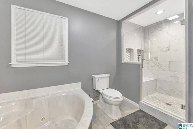 bathroom with toilet, a tub with jets, a shower stall, tile patterned flooring, and baseboards