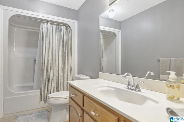 full bath featuring shower / tub combo, toilet, and vanity