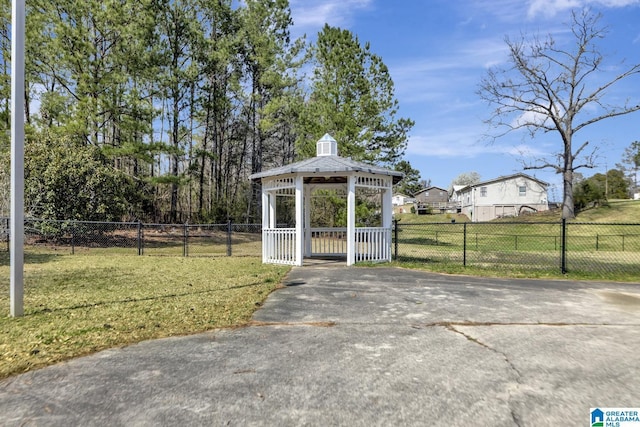 view of outdoor structure with a gazebo and fence