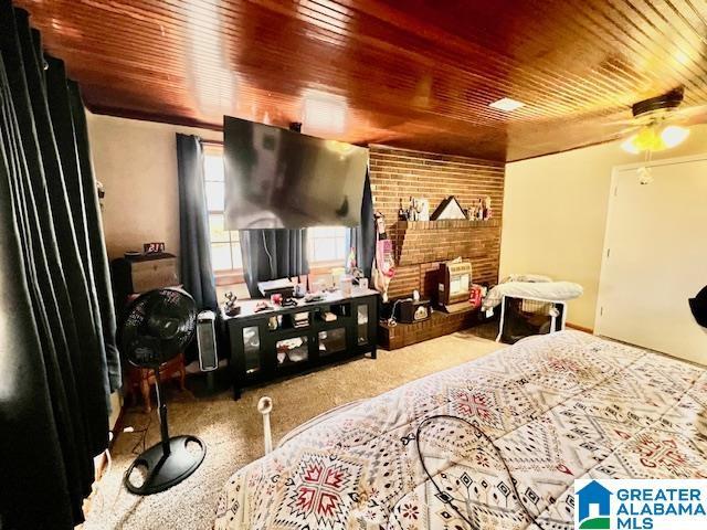 carpeted bedroom with wooden ceiling