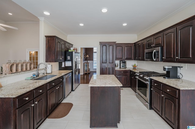 kitchen with a kitchen island, a sink, stainless steel appliances, dark brown cabinets, and tasteful backsplash