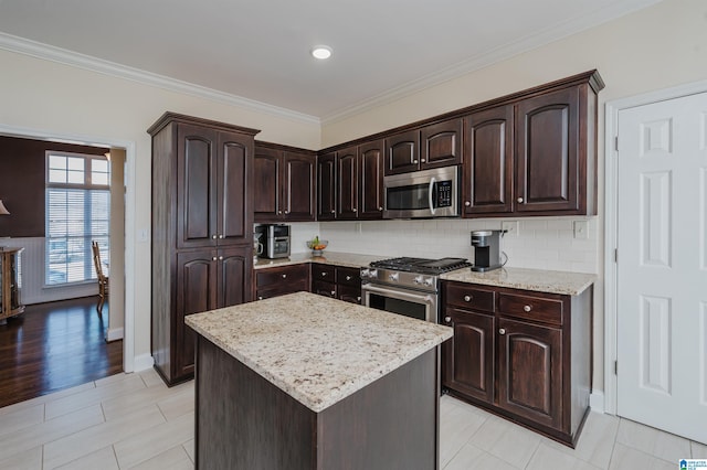 kitchen featuring dark brown cabinets, backsplash, stainless steel appliances, and crown molding