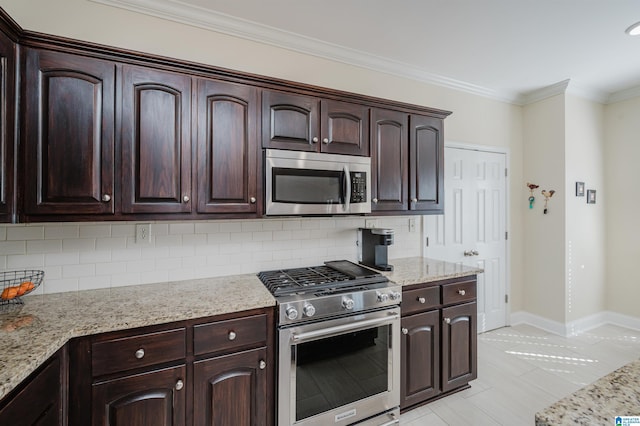 kitchen featuring dark brown cabinets, appliances with stainless steel finishes, and crown molding