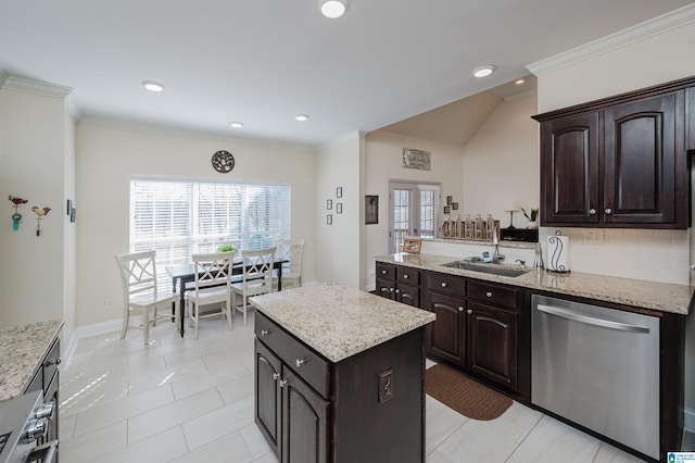 kitchen featuring backsplash, ornamental molding, appliances with stainless steel finishes, and a sink