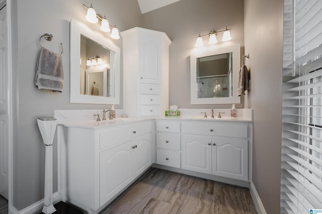 bathroom with vanity and baseboards