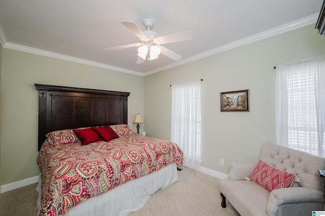 bedroom with light carpet, a ceiling fan, baseboards, and ornamental molding