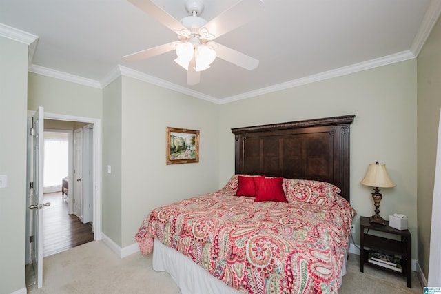 bedroom with a ceiling fan, baseboards, carpet floors, and ornamental molding