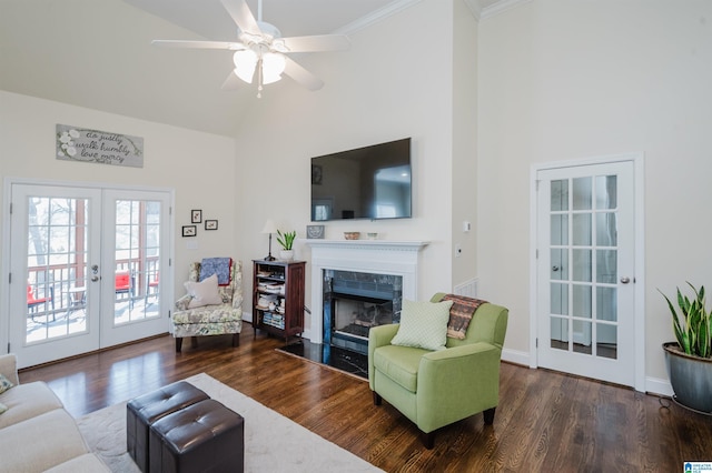 living room with a premium fireplace, french doors, wood finished floors, high vaulted ceiling, and a ceiling fan