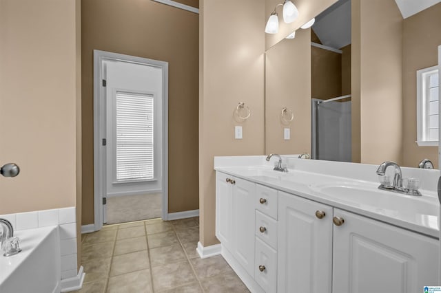 full bathroom featuring a sink, walk in shower, a bath, and tile patterned flooring