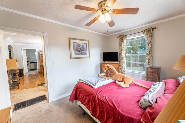 819 Jefferson Ave, Anniston, AL 36207 - bedroom with baseboards, carpet, ornamental molding, arched walkways, and a textured ceiling