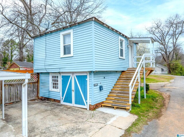 819 Jefferson Ave, Anniston, AL 36207 - exterior space featuring stairway and fence
