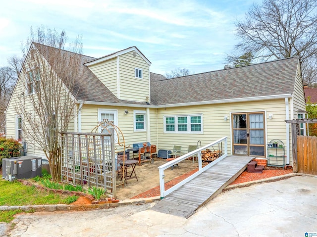 819 Jefferson Ave, Anniston, AL 36207 - back of house with a patio, a shingled roof, and central AC