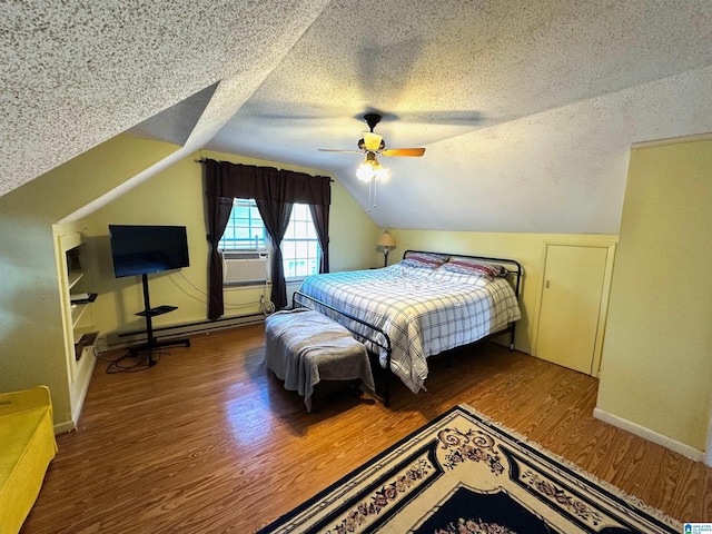 bedroom featuring a ceiling fan, a textured ceiling, wood finished floors, lofted ceiling, and baseboard heating