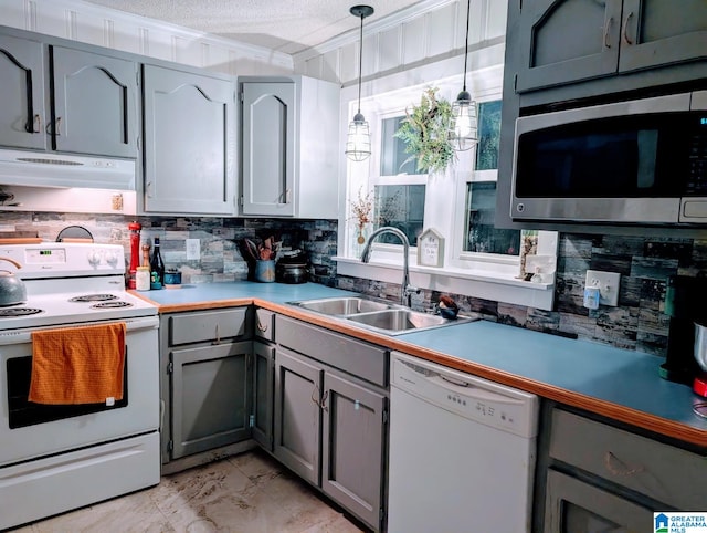 5242 Roy Dr, Helena, AL 35080 - kitchen featuring white appliances, gray cabinets, a sink, backsplash, and under cabinet range hood