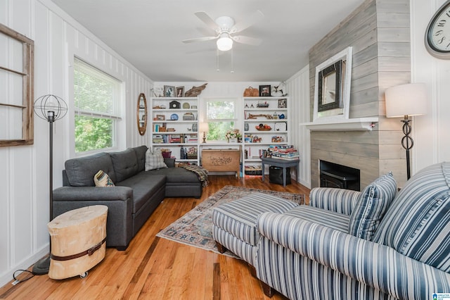 5242 Roy Dr, Helena, AL 35080 - living room featuring ceiling fan, wood finished floors, and a fireplace