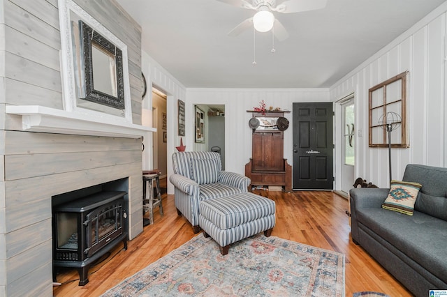 5242 Roy Dr, Helena, AL 35080 - living room with crown molding, a wood stove, wood finished floors, and ceiling fan