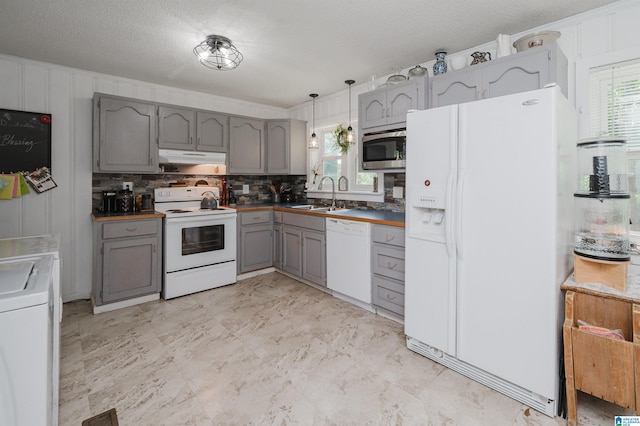 5242 Roy Dr, Helena, AL 35080 - kitchen featuring gray cabinetry, white appliances, under cabinet range hood, and plenty of natural light