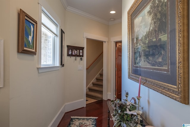 hall featuring baseboards, stairs, ornamental molding, recessed lighting, and wood finished floors