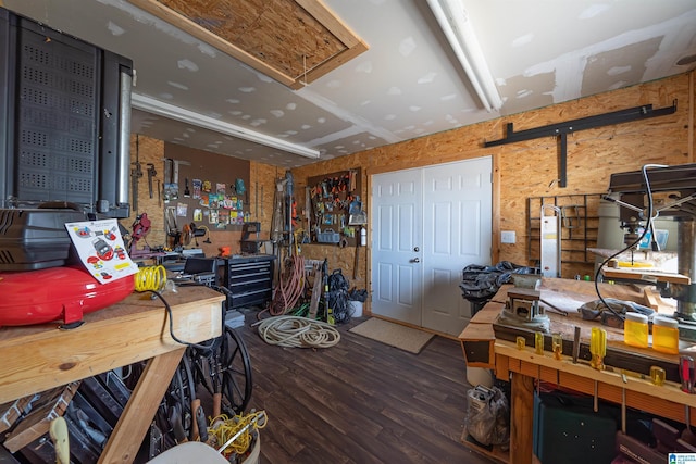 interior space featuring a workshop area and wood finished floors